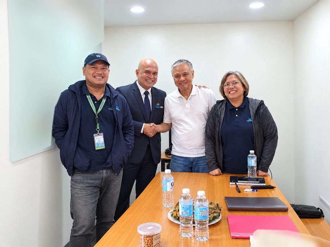 SolarMD and Macondray Plastics Products management shaking hands at the signing
